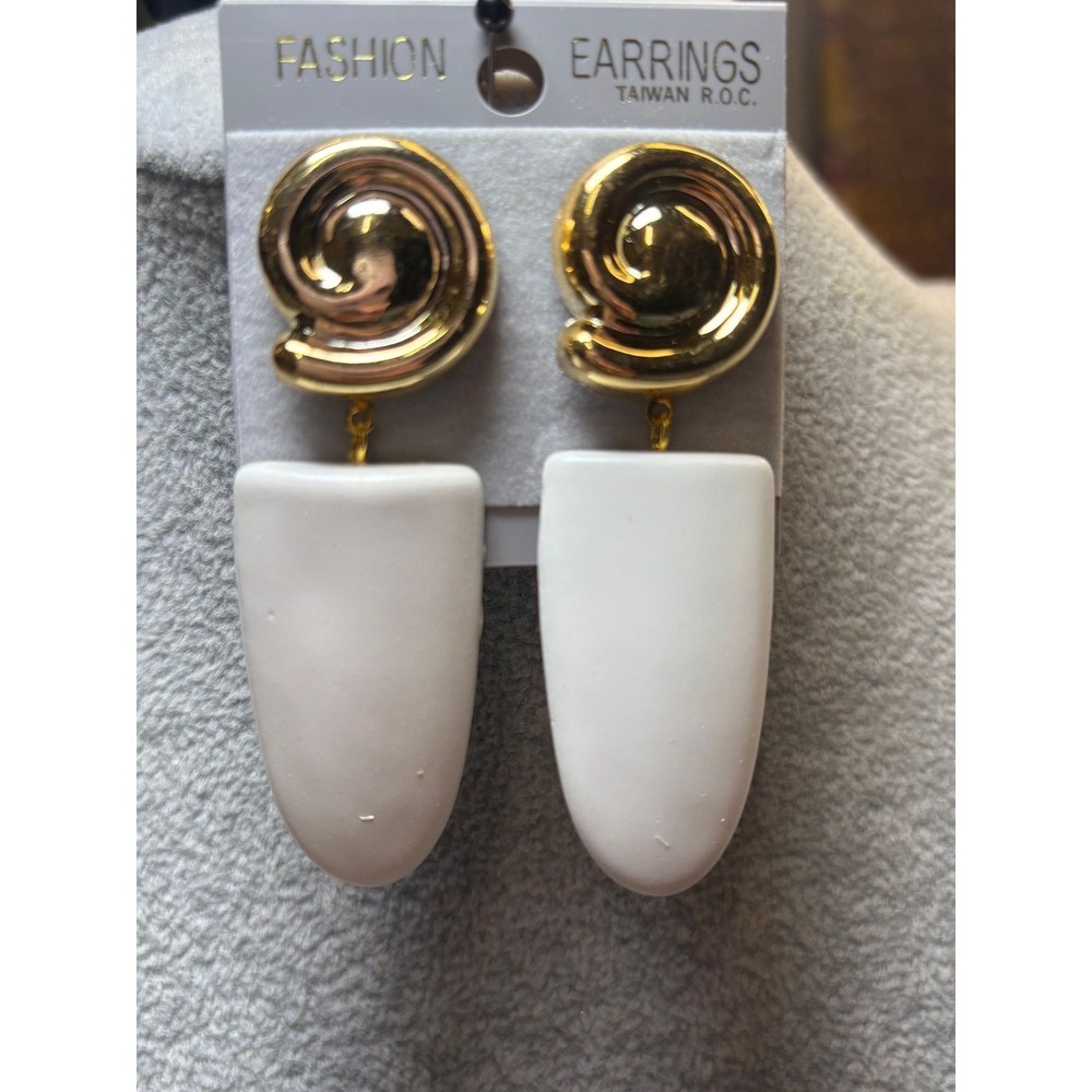 #13.  Spiral top elongated white drop earrings.